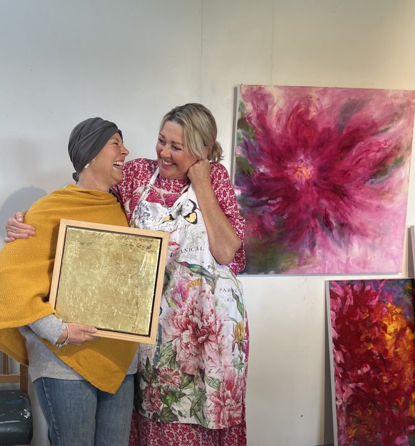 Art collector and Cassandra laughing
